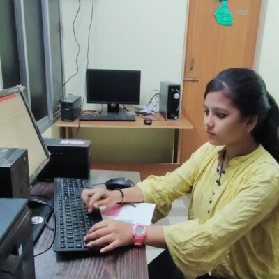 Sangeeta using a computer.