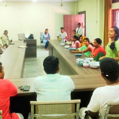 An entrepreneur showcasing their recycled plastic products at the Janakpur workshop.